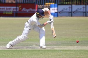 free-photo-of-cricket-player-striking-ball-on-field (1)